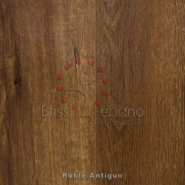 Superficie de madera con gotas de lacre rojizo y marca "bliss Piso Laminado Roble Antiguo".