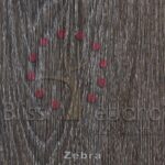 Piso de PVC Zebra dispuesto en forma de signo de interrogación sobre una superficie de madera texturizada con las palabras "zebra", "bliss", "edenoro" y "josh maddocks" escritas debajo.