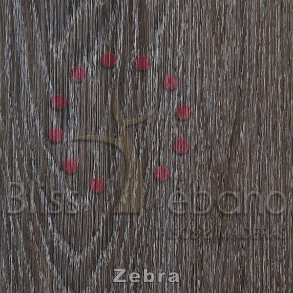 Piso de PVC Zebra dispuesto en forma de signo de interrogación sobre una superficie de madera texturizada con las palabras "zebra", "bliss", "edenoro" y "josh maddocks" escritas debajo.